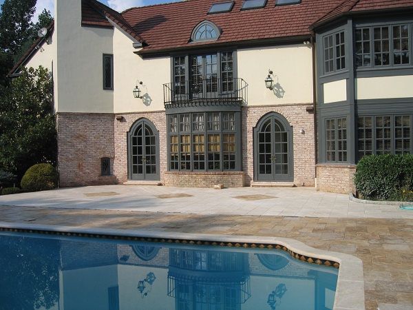 Gothicstone Noce Travertine pool deck with light Cream Travertine Coping