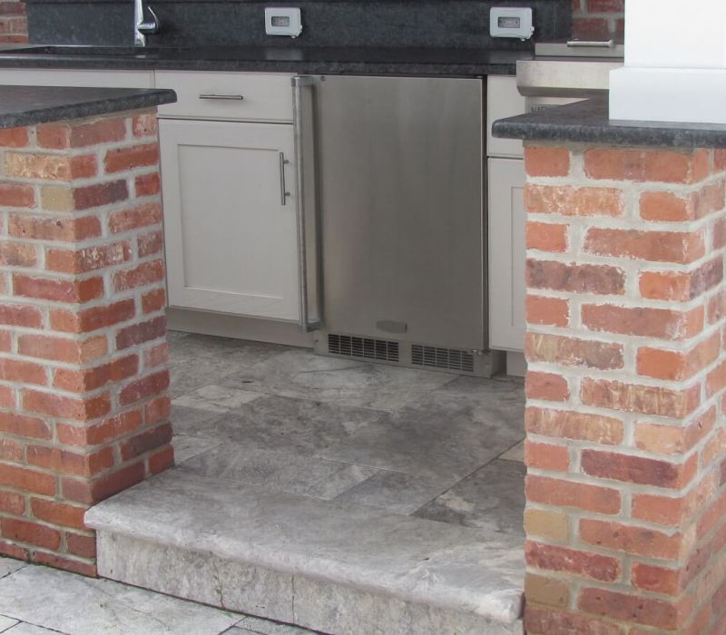 silver travertine brick outdoor kitchen